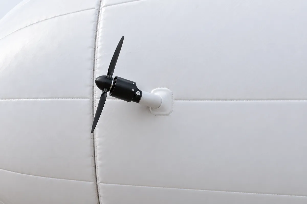 Close-up of a vectoring pod: a two-blade propeller on a tilting support at the side of the hull